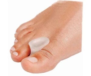 Silicone toe separator placed between toes for comfort.